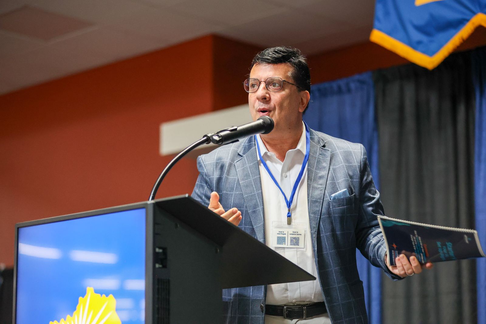David Dean Mauro at the podium during an AI awareness keynote