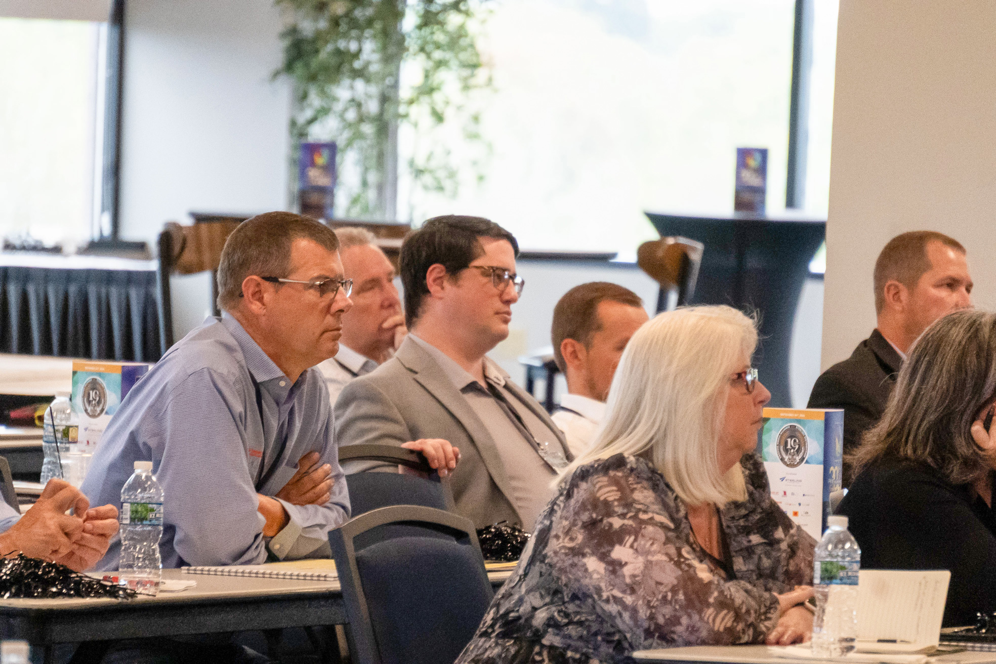 Business leaders listening during a live cybersecurity training